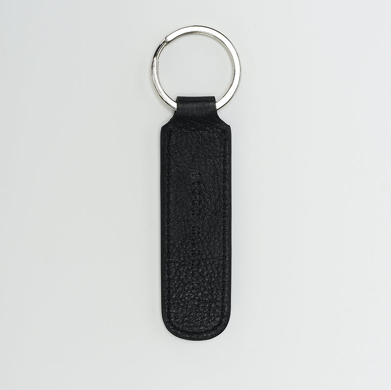 Tan and black leather keychain for bike